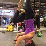 Yoga headstand in the gym